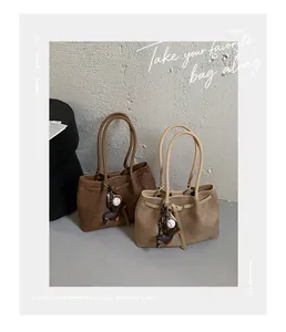 Two large-capacity commuter tote bags in brown and khaki featuring cute dachshund charms.