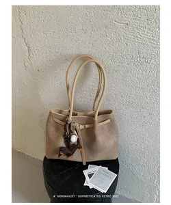 Elegant khaki textured commute tote bag with a cute puppy charm and minimalist design