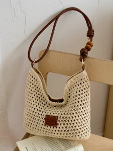 Large capacity handmade crochet straw tote bag with beaded strap for beach vacation.
