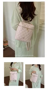 Elegante zaino trapuntato rosa da donna con catene dorate e dettaglio a cuore