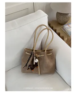Sophisticated large retro tote bag displayed on a white sofa in a minimalist setting