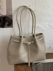 Elegant large capacity beige commuter tote bag for women with premium textured finish