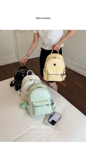 Stylish woven texture backpacks in various colors featuring cute duck charms and accessories