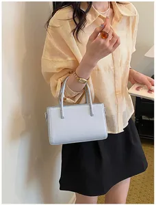 Minimalist light blue small handbag shown with lifestyle fashion styling for commute
