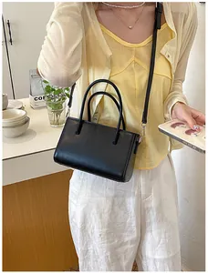 Chic black minimalist handbag shown as a stylish crossbody bag for office commuting
