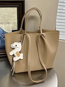 Large capacity khaki leather tote bag with cute white horse charm for commuter style