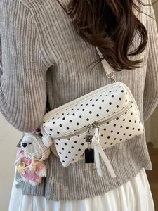Stylish white polka dot crossbody bag for women with cute robot charm and strap