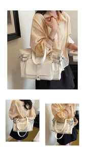 Multi-angle view of large cream tote bag with buckle details on a model