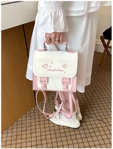 Detailed view of pink and white commuter backpack with sweet heart embroidery for women