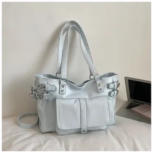 Detail of a light blue large capacity tote bag with buckle accents for daily commuting.