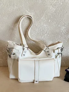 Stylish large white commuter tote bag with buckle details and functional front pocket
