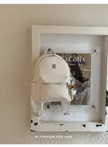 Fashionable creamy white woven backpack for women, perfect for travel and daily commuting.