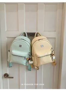 Premium woven texture women's backpacks in mint green and yellow for stylish travel