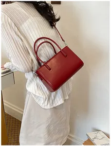 Stylish red leather crossbody bag for women, perfect for daily commuting outfits