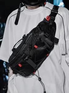 Tactical black chest bag with functional straps and red accents for urban techwear style