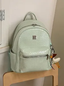 Stylish mint green woven leather backpack for women, casual daily travel rucksack.