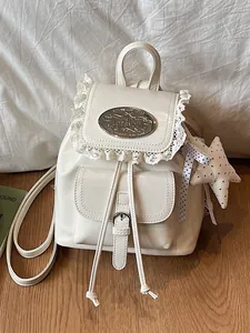 Vintage white mini backpack with lace trim, metallic badge and cute star keychain accessory
