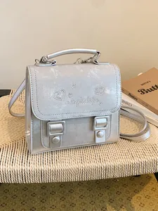 Stylish silver lightweight backpack for women with heart embroidery and sturdy top handle