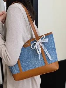 Elegant large capacity blue denim tote bag for women featuring pearl lace bow and leather straps