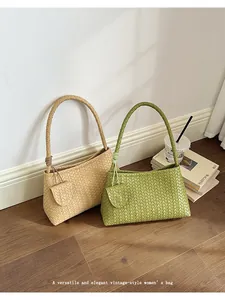 Elegant woven underarm bag for women in green and beige, vintage summer fashion style