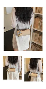 Elegant Korean style cylindrical crossbody bag for women with a cute bear charm