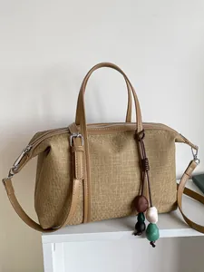 Large capacity khaki canvas shoulder bag for women with decorative bead tassel charm