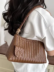 Sophisticated brown woven underarm bag for women with minimalist commuter style