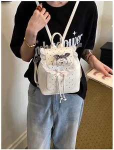 Model wearing a white sweet mini backpack with lace trim and cartoon dog character