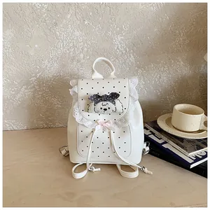 Sweet white mini backpack featuring lace trim, polka dots and a cute dog embroidery motif.