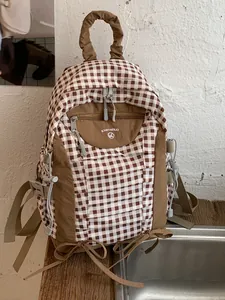 Stylish brown and white checkered lightweight backpack with Korean aesthetic for daily commuting