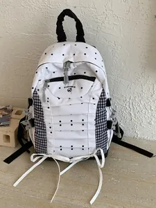 Stylish minimalist polka dot and plaid backpack for student travel and daily commuting