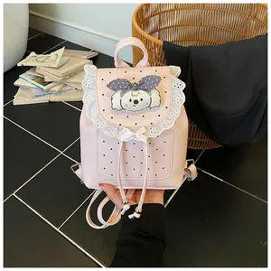 Exquisite detail view of pink mini backpack with lace trim and cute puppy patch design