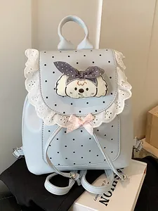 Sweet light blue mini lace backpack featuring polka dots and cute cartoon puppy detail