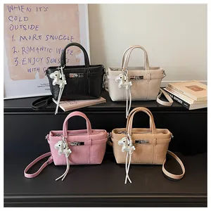 Collection of four trendy commute tote bags in black, cream, pink, and tan colors