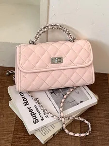 Elegant pink quilted small square handbag with chain strap and handle on design books