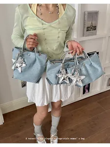 Versatile denim tote and dumpling style handbags featuring silver star charms