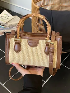 Stylish straw woven handbag with bamboo handle perfect for summer beach vacations.