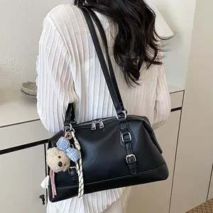 Elegant large capacity black Boston shoulder bag with bear charm for daily commute