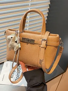 Elegant khaki textured leather bucket handbag for women commuting with cute animal charm
