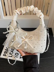 Sac croissant design en tweed avec poignée plissée et décoration nœud en perles et dentelle