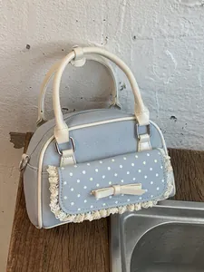 Elegante hellblaue Canvas-Handtasche für Damen mit Punktetasche und Spitzenbogendetail