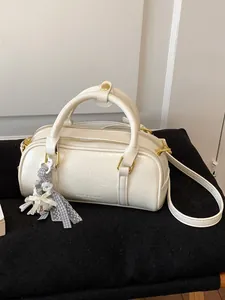 Elegant cream white wrinkled patent leather pillow handbag with gold hardware