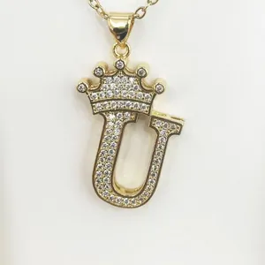 Elegant gold-plated initial U pendant necklace featuring a crown and sparkling zircons