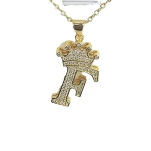 Golden stainless steel necklace with zircon-encrusted crown letter F pendant.