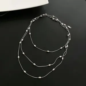 Triple-layer vintage silver beaded necklace with elegant layered design for women