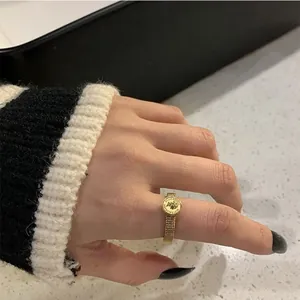 Vintage gold plated Elizabeth II coin ring featuring a unique mesh textured band design