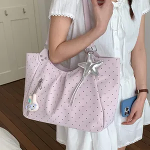 Stylish lavender polka dot underarm bag featuring cute silver star and bunny charms
