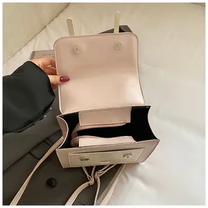 Detailed interior view of a small pink fashionable women's backpack showing the zipper pocket