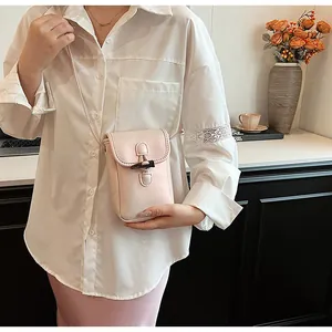 Elegant small pink crossbody phone bag for women featuring a stylish toggle closure