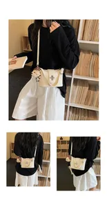Stylish cream white bucket bag with turn-lock and bear charm shown in lifestyle setting